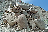 Ladakh - pile of stones on  mountain pass with the characteristc prayer flags